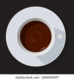 Black tea cup on black background. Top view.
