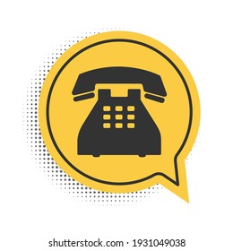 Black Telephone icon isolated on white background. Landline phone. Yellow speech bubble symbol. Vector