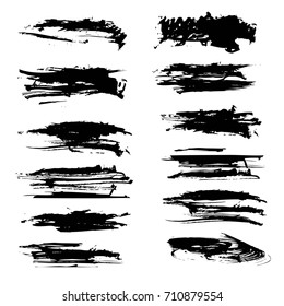 Black textured brush strokes different shapes isolated on a white background