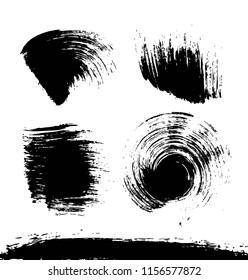 Black textured smears of different forms set isolated on a white background