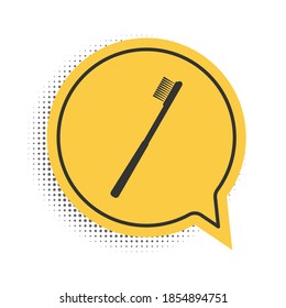 Black Toothbrush icon isolated on white background. Yellow speech bubble symbol. Vector.