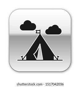 Black Tourist tent with flag icon isolated on white background. Camping symbol. Silver square button. Vector Illustration