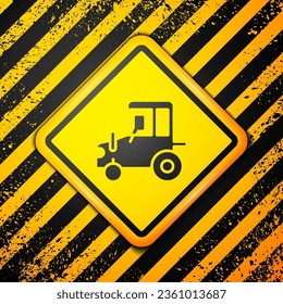Black Tractor icon isolated on yellow background. Warning sign. Vector