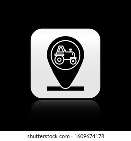 Black Tractor and location icon isolated on black background. Silver square button. Vector Illustration