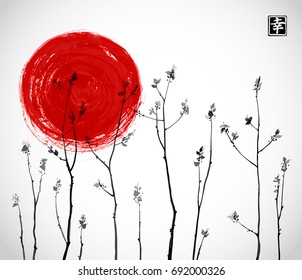 Black Tree branches with fresh leaves and big red sun on white background. Contains hieroglyph - happiness. Traditional oriental ink painting sumi-e, u-sin, go-hua
