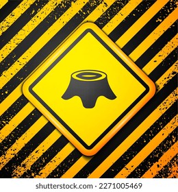 Black Tree stump icon isolated on yellow background. Warning sign. Vector