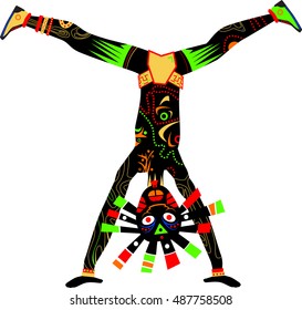 Black tribal dancer standing on his hands. Tribal dance
