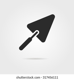 black trowel icon with shadow. concept of implement, workshop, household, create, major overhaul, roughcast. isolated on gray background. flat style trend modern logo design vector illustration