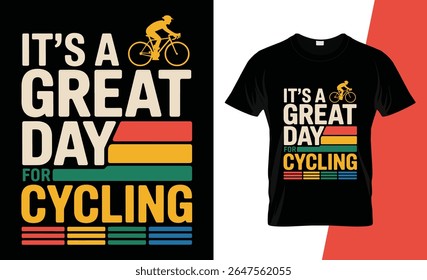 A black t-shirt design featuring bold text that reads "It's a Great Day for Cycling" with a cyclist silhouette and retro color stripes.