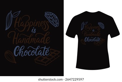 A black t-shirt displays a design with the text "Happiness is Handmade Chocolate" surrounded by cacao elements.
