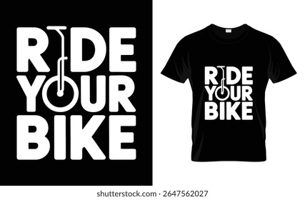 A black t-shirt features white text that reads "Ride Your Bike", with the letter 'O' in 'YOUR' creatively replaced by a bicycle wheel.