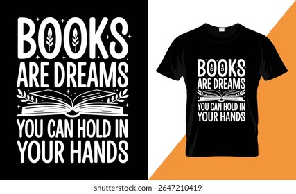 A black t-shirt featuring a white graphic design with the text "BOOKS ARE DREAMS YOU CAN HOLD IN YOUR HANDS" and an illustration of an open book with leaves.