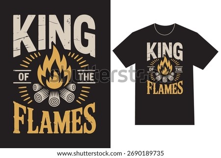 Black t-shirt showcases bold King of the Flames graphic with a blazing bonfire atop logs, rendered in distressed beige and gold hues, symbolizing warmth.