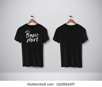 Black T-Shirts Mock-up clothes with lettering an V and round neck hanging on wall.