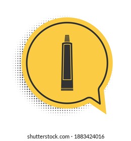 Black Tube of toothpaste icon isolated on white background. Yellow speech bubble symbol. Vector.