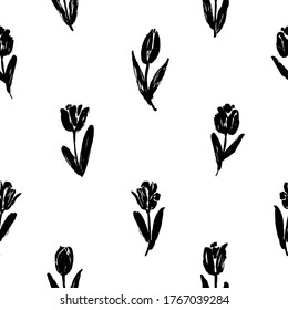 Black tulips vector seamless pattern. Hand drawn silhouettes of spring flowers, tulips, narcissus and iris. Dry brush style floral motives. Black paint illustration with abstract flowers