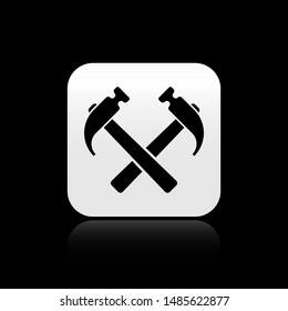 Black Two crossed hammers icon isolated on black background. Tool for repair. Silver square button. Vector Illustration