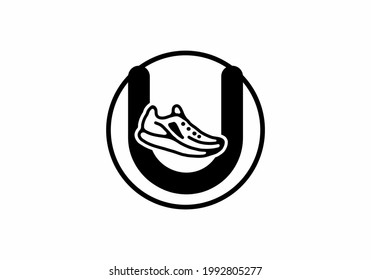 Black U initial letter with shoes in circle design