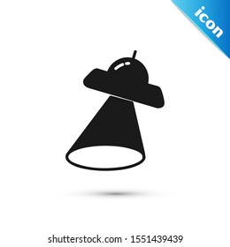 Black UFO flying spaceship icon isolated on white background. Flying saucer. Alien space ship. Futuristic unknown flying object.  Vector Illustration