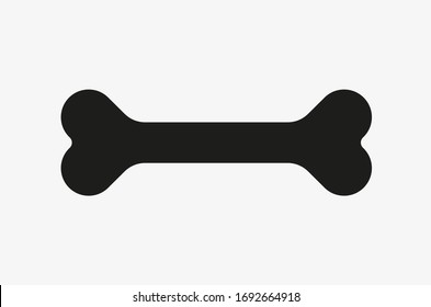 Black vector illustration of bone isolated on white background. Symbol of dog food. Bone icon vector.