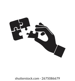 Black vector illustration of hand holding puzzle piece, symbolizing strategy, teamwork, and ideas