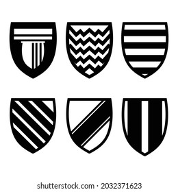 Black  vector illustration of a set shields icons, isolated on a gray background.