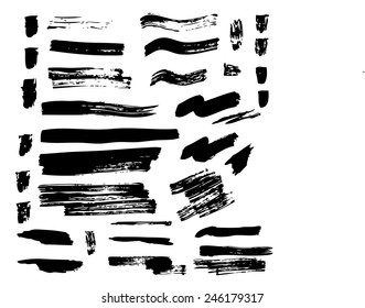 black vector set of brush strokes and spots