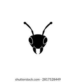 Black vector silhouette illustration of a front-facing ant head featuring antennae and mandibles, isolated on a white background