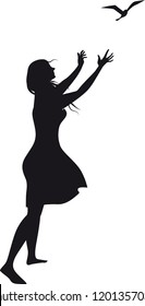 Black vector silhouette of a woman, releasing a bird, drawn from imagination, no model release necessary, EPS 8 vector illustration