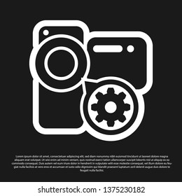 Black Video camera and gear icon isolated on black background. Adjusting app, service concept, setting options, maintenance, repair, fixing. Vector Illustration