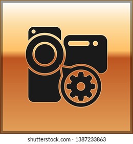 Black Video camera and gear icon isolated on gold background. Adjusting app, service concept, setting options, maintenance, repair, fixing. Vector Illustration