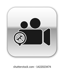 Black Video camera with screwdriver and wrench icon isolated on white background. Adjusting, service, setting, maintenance, repair, fixing. Silver square button. Vector Illustration