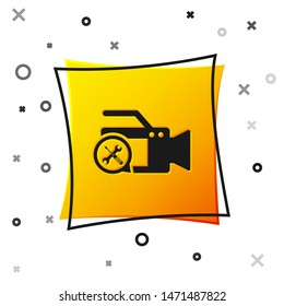 Black Video camera with screwdriver and wrench icon isolated on white background. Adjusting, service, setting, maintenance, repair, fixing. Yellow square button. Vector Illustration