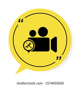 Black Video camera with screwdriver and wrench icon isolated on white background. Adjusting, service, setting, maintenance, repair, fixing. Yellow speech bubble symbol. Vector Illustration