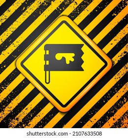 Black Viking flag icon isolated on yellow background. Warning sign. Vector
