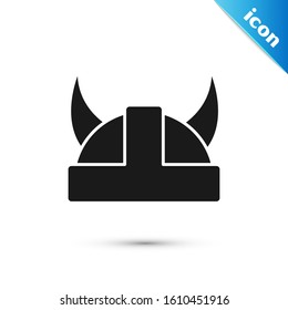 Black Viking in horned helmet icon isolated on white background.  Vector Illustration