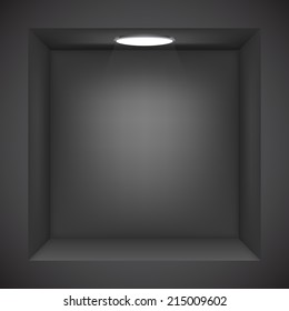 Black wall with empty niche for exhibition.