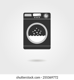 black washing machine with shadow. concept of homework, domestic work, consumer electronics, laundry room, washhouse. isolated on grey background. flat style modern logo design vector illustration