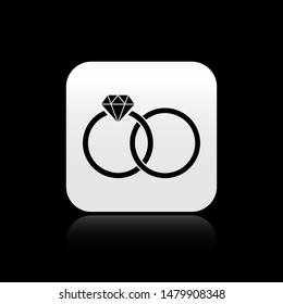 Black Wedding rings icon isolated on black background. Bride and groom jewelery sign. Marriage Diamond ring icon. square button. Vector Illustration