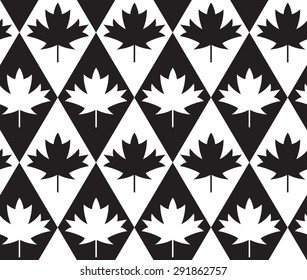 Black and white alternating maple leaves on diamonds.Seamless stylish geometric background. Modern abstract pattern. Flat monochrome design.