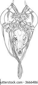 black and white animal skull decorated with ropes and flowers