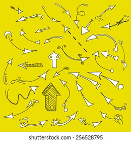Black and white arrows painted by hand. yellow background