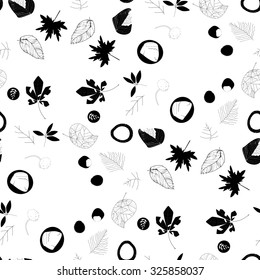 Black and white background with autumn leaves and fruits.