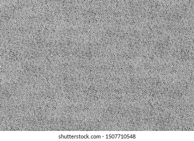 Black and white background of a knitted textile material with pattern lines, shapes, dots, circles. Fabric with a striped texture closeup