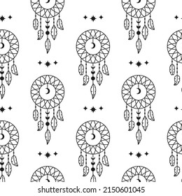 Black and white boho seamless pattern with dreamcatchers, crescent moon and feathers. Bohemian modern background. Celestial wrapping paper.