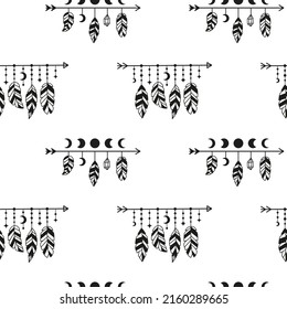 Black and white boho seamless pattern with arrows, moon phases and feathers. Bohemian modern background. Celestial wrapping paper.
