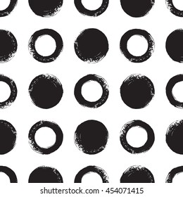 Black and white brush drawn circles seamless vector pattern. Round shapes background. Monochrome texture.