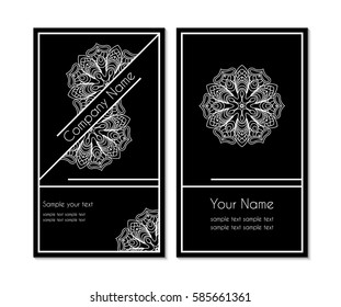 black and white business card with a circular ornamental design. Contour lacy white pattern on a dark background