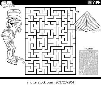 Black and white cartoon illustration of educational maze puzzle game for children with mummy character and pyramid coloring book page