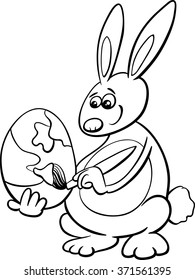 Black and White Cartoon Vector Illustration of Easter Bunny Painting Paschal Egg for Coloring Book